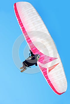 Person, parachute or paragliding in air in nature, exercise or healthy adventure for extreme sport. Athlete, glide and