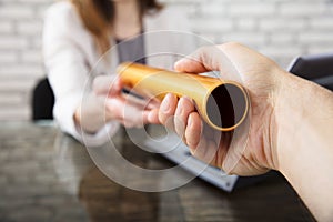 Person Passing Baton To Businesswoman