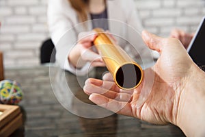 Person Passing Baton To Businesswoman