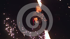 Person performed dances with fire in the night on the street