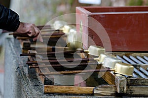 Person performing ablution.