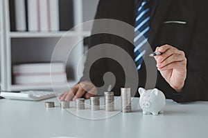 Person with pile of coins and piggy bank, money saving concept for future use and financial stability, salary management, personal