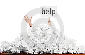 Person in pile of papers photo