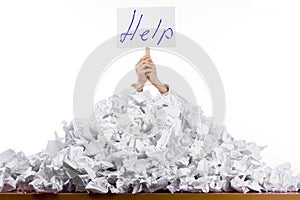 Person in pile of papers