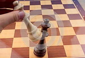 Person playing chess game making a move
