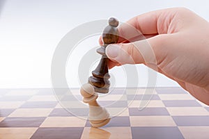 Person playing chess game making a move
