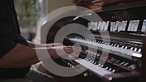 A person playing a church organ