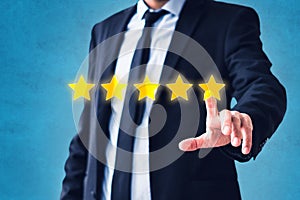 Person pointing on 5 star review, costumer feedback concept - five stars rating