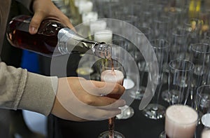 Person pouring champagne