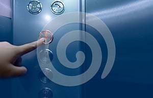 Person pressing on the fifth floor of elevator button. Hand press number 5 on button inside office or hotel lift. Index finger