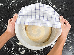 Person proofing dough under clothing photo