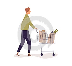 Person pushing shop cart full of bags with groceries. Man walking with shopping trolley. Profile of buyer going with