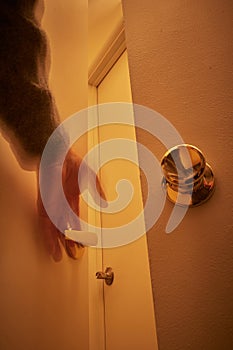 Person reaching out for doorknobs and handles