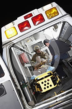 Person Receiving Medical Aid Inside Ambulance