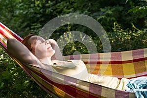 Person relaxing in Hummock at Summer Garden side View