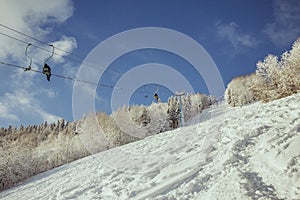 A person riding skis down a snow covered slope