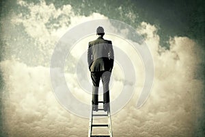 Person rising on way to success by stairway to heaven