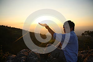 Person on the rock. Sport and active life a man on a mountain top concept. Beauty world.