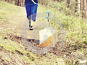 Person run to check point. Outdoor orienteering check point photo