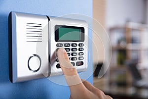 Person`s Finger Entering Code In Security System
