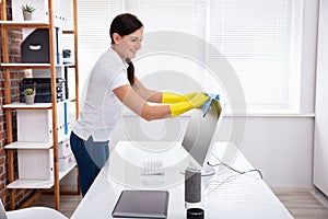 Person`s Hand Cleaning Desktop Screen