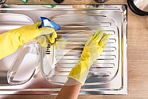 Person`s Hand Cleaning Stainless Steel Sink