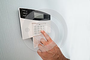 Person's hand entering code