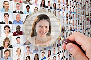 Person`s Hand Holding Magnifying Glass