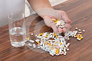 Person`s Hand Holding Pills