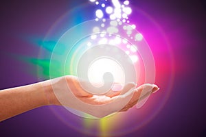 Person`s Hand Into Magical Healing Energy Field