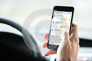 Person`s Hand With Mobilephone Text Messaging