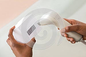 Person`s Hand Scanning Barcode With Barcode Scanner