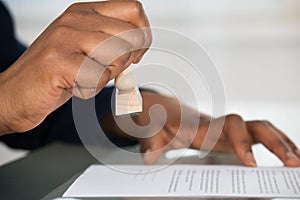 Person`s Hand Stamping On Contract Form