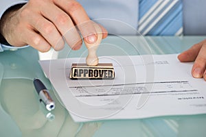 Person`s Hand Stamping On Document