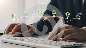 a person's hand using a computer mouse on a desk