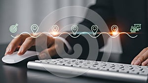 a person's hand using a computer mouse on a desk