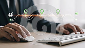 a person's hand using a computer mouse on a desk