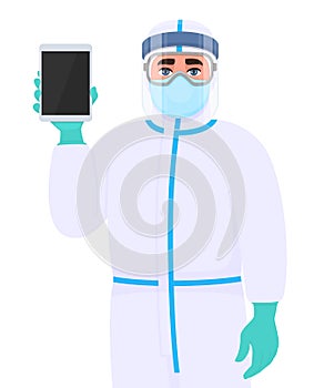 Person in safety protection suit, medical mask, glasses and face shield showing tablet computer. Doctor or physician holding tab.