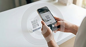 Person Scanning QR Code With Smartphone For Mobile Payment
