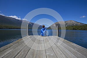 Person seated at Nelson lakes Pontoon