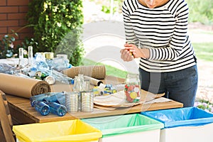 Person segregating waste on terrace