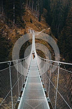 Person on a self-anchored suspension bridge