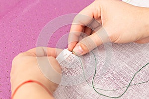 Person sewing fabric