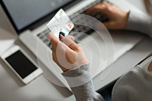 Person shopping making Payment at Computer using Credit Card