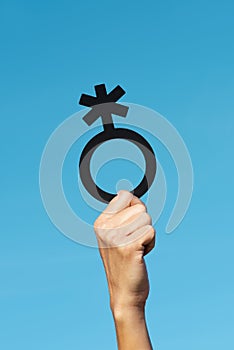 Person showing a non-binary gender symbol