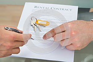 Person signing rental contract