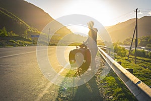 Person silhouette in the mountains with bicycle