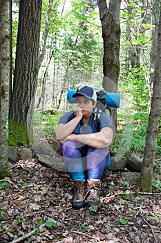 Person sitting alone in the woods