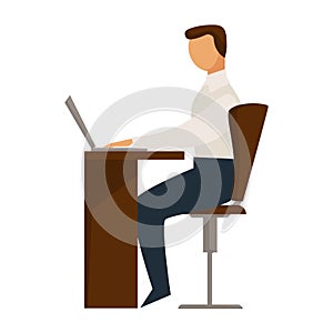 Person sitting in chair behind desk properly and working on laptop