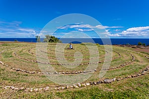 Person Sitting in Maui Labyrinth photo